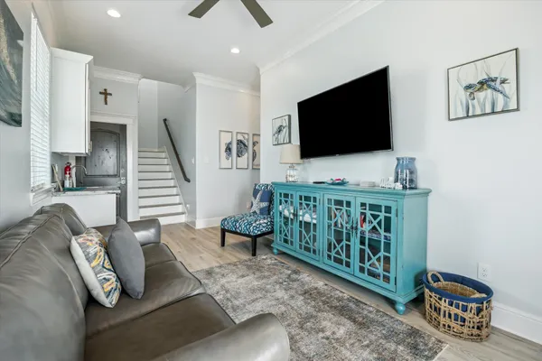a room with furniture and a flat screen tv