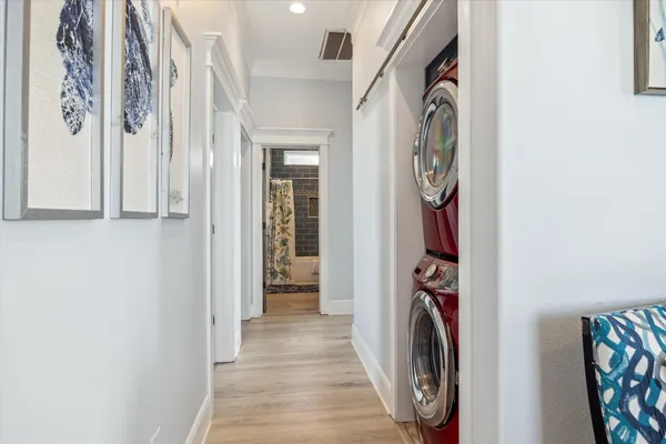 a view of a storage and utility room with a washer and dryer