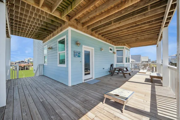 a view of a porch with wooden floor