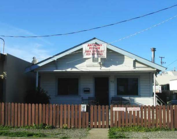 512 Third Street Rodeo, CA 94572 - Photo 1 of 1 a front view of a house with a yard