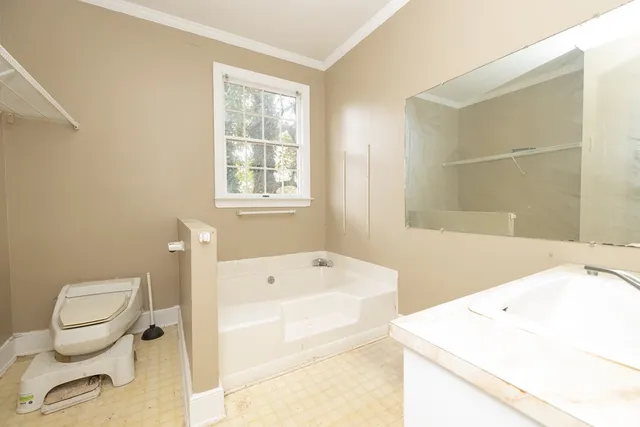a view of a storage & utility room with windows