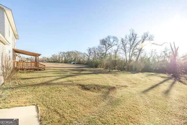 a house view with a backyard space