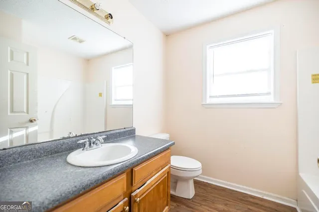 a bathroom with a sink and a toilet