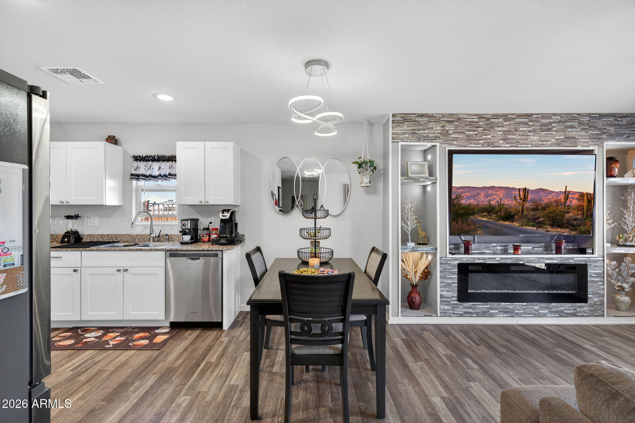14423 South Capistrano Road Arizona City, AZ 85123 - Photo 15 of 36 a living room with stainless steel appliances kitchen island granite countertop furniture and a kitchen view
