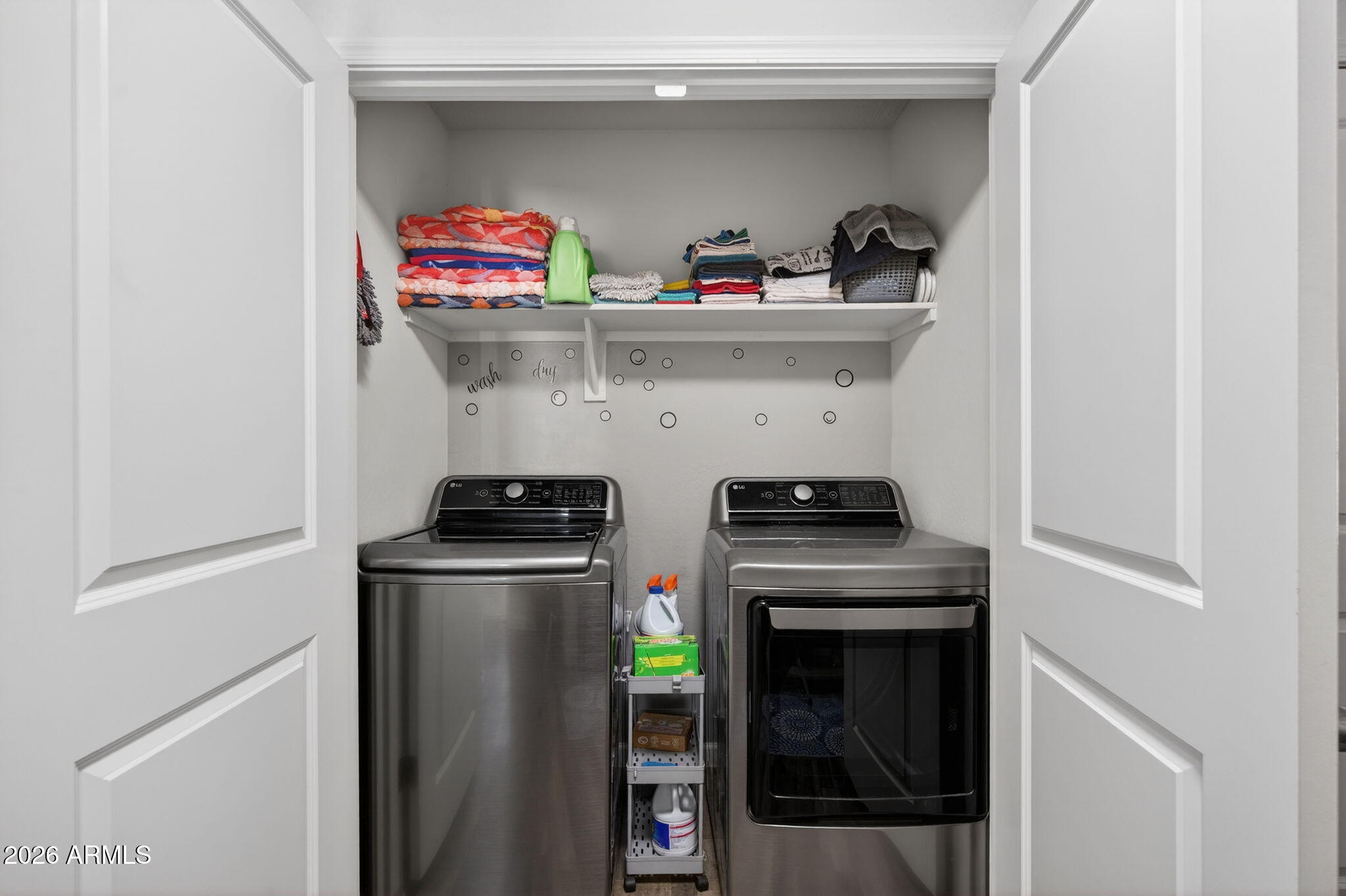 14423 South Capistrano Road Arizona City, AZ 85123 - Photo 16 of 36 a kitchen with a stove and cabinets