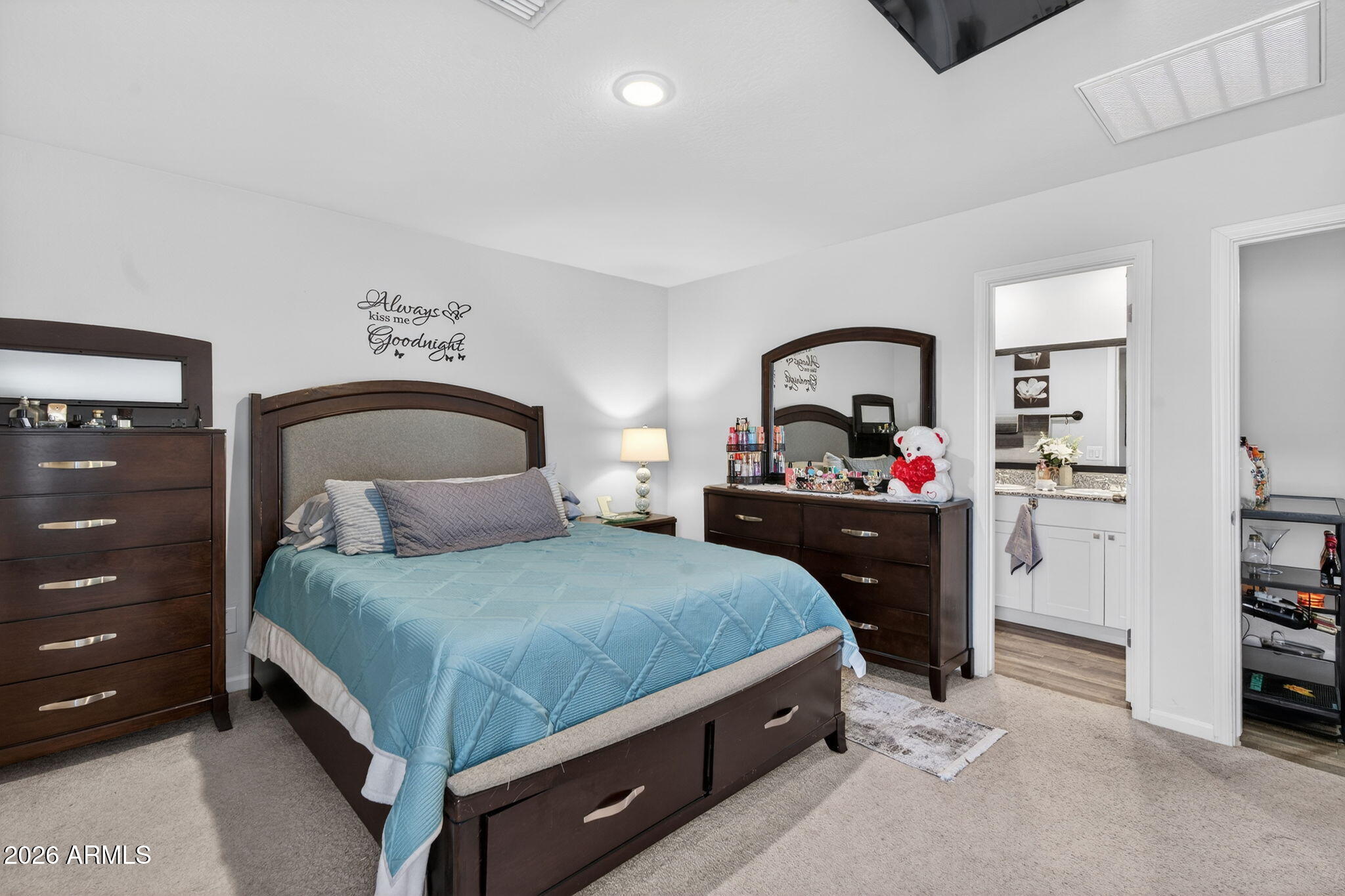 14423 South Capistrano Road Arizona City, AZ 85123 - Photo 18 of 36 a bedroom with a bed and a dresser