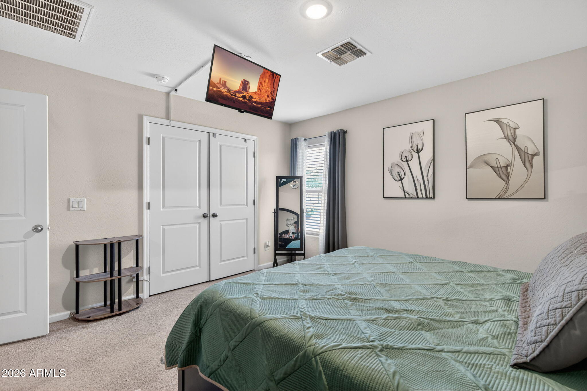 14423 South Capistrano Road Arizona City, AZ 85123 - Photo 19 of 36 a bedroom with a bed and a view of bathroom