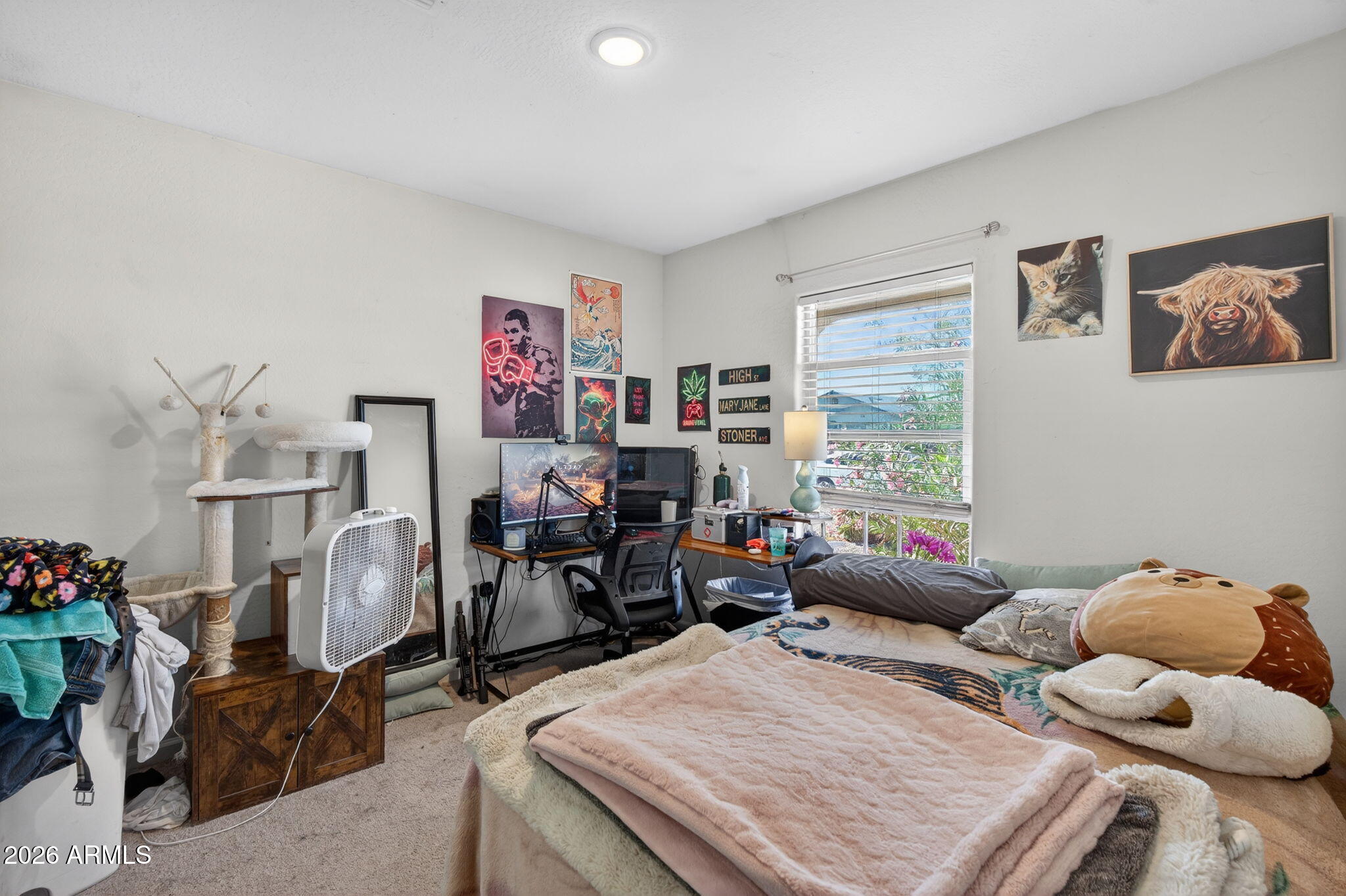14423 South Capistrano Road Arizona City, AZ 85123 - Photo 22 of 36 a bed room with a bed and a large window