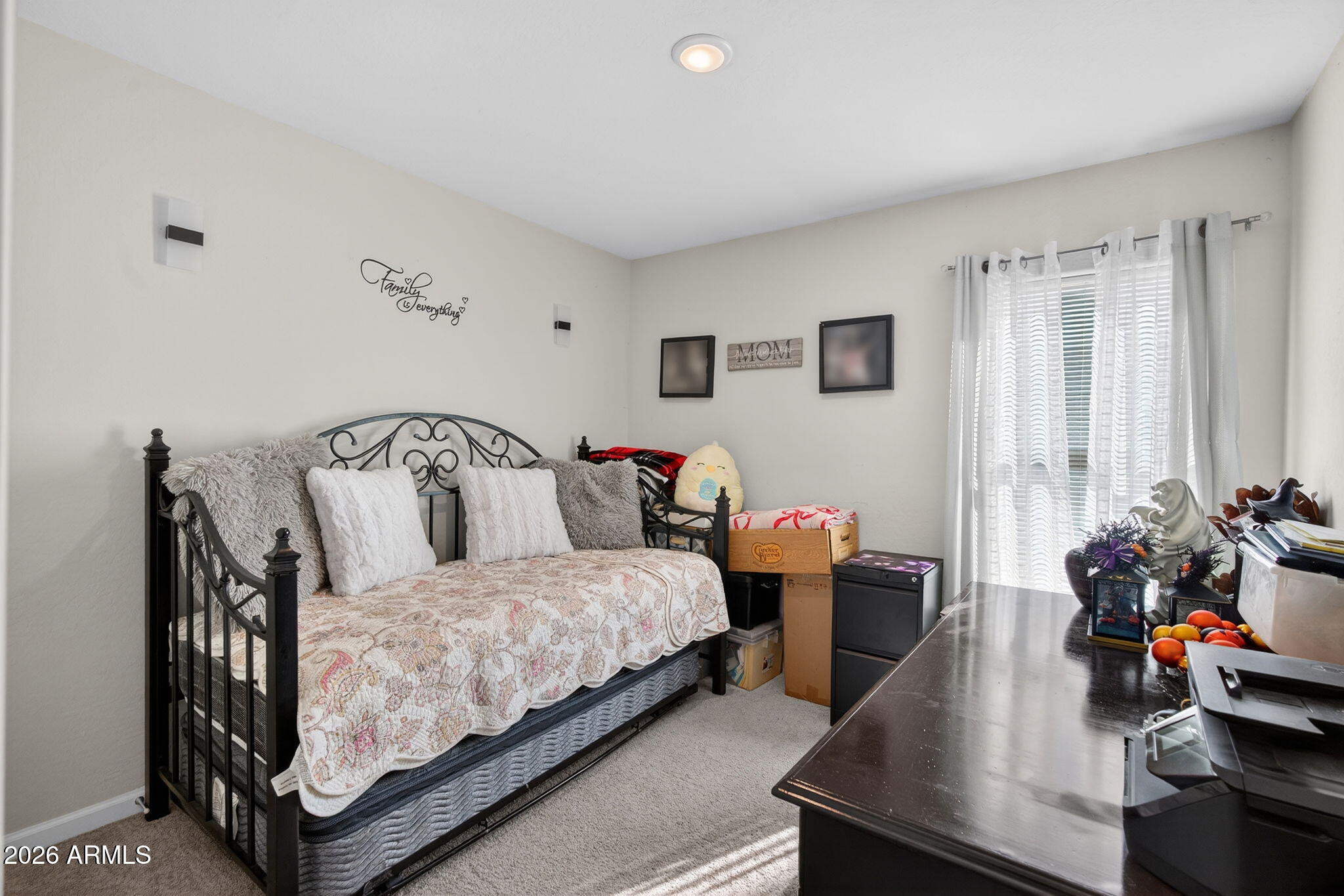 14423 South Capistrano Road Arizona City, AZ 85123 - Photo 23 of 36 a bedroom with bed and a couch