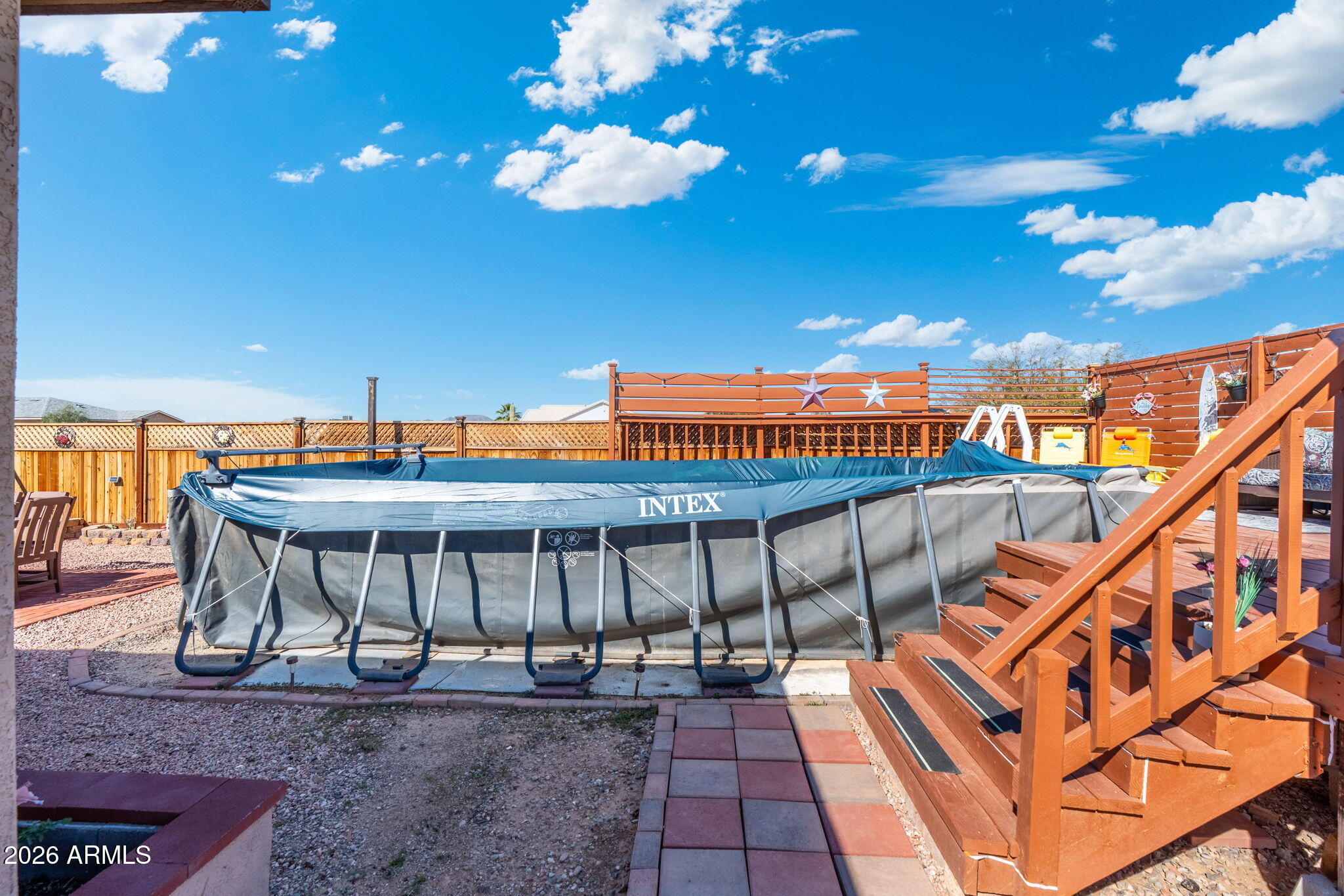 14423 South Capistrano Road Arizona City, AZ 85123 - Photo 29 of 36 a view of a balcony with furniture