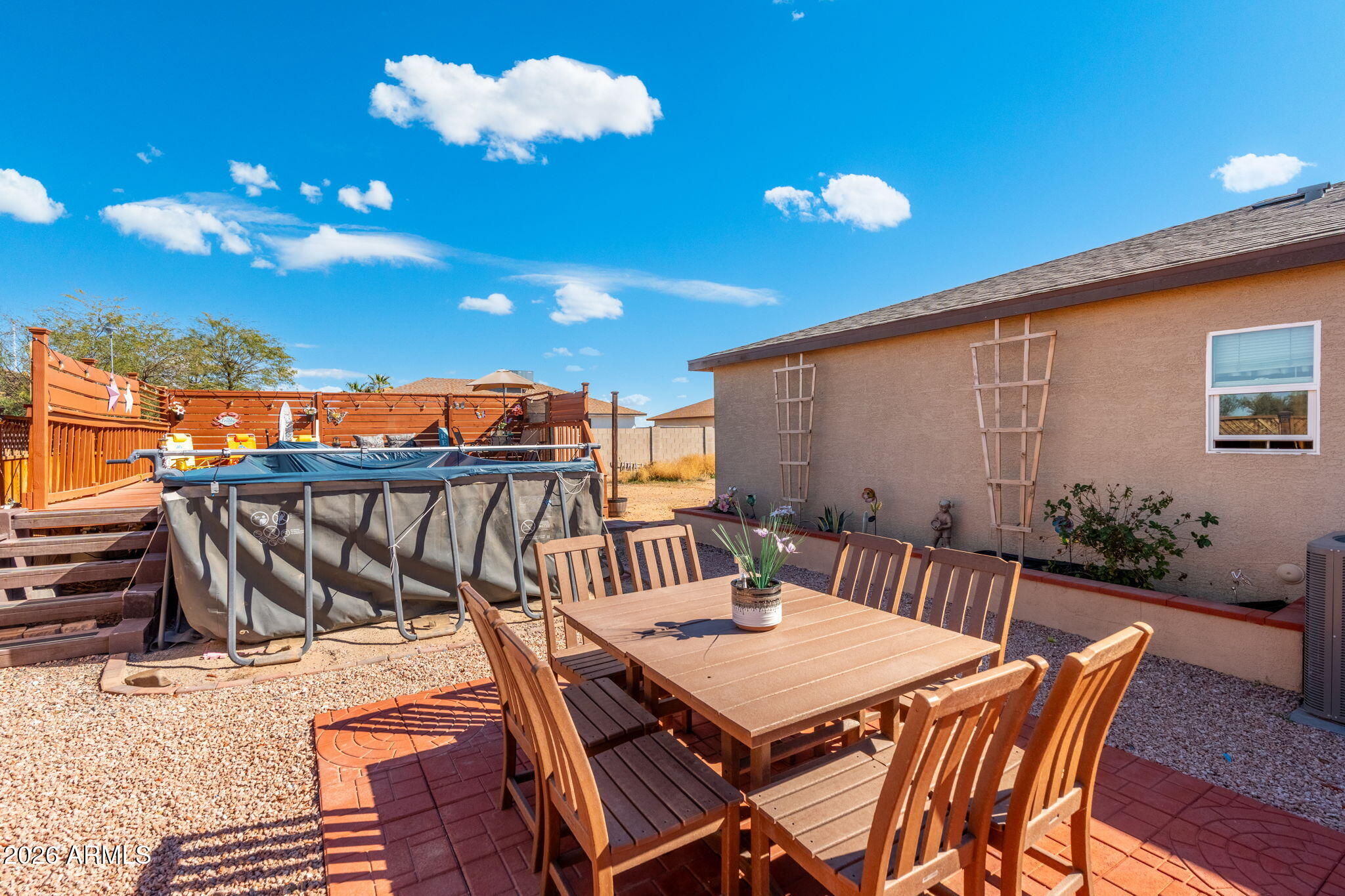 14423 South Capistrano Road Arizona City, AZ 85123 - Photo 34 of 36 a view of a patio with a table and chairs