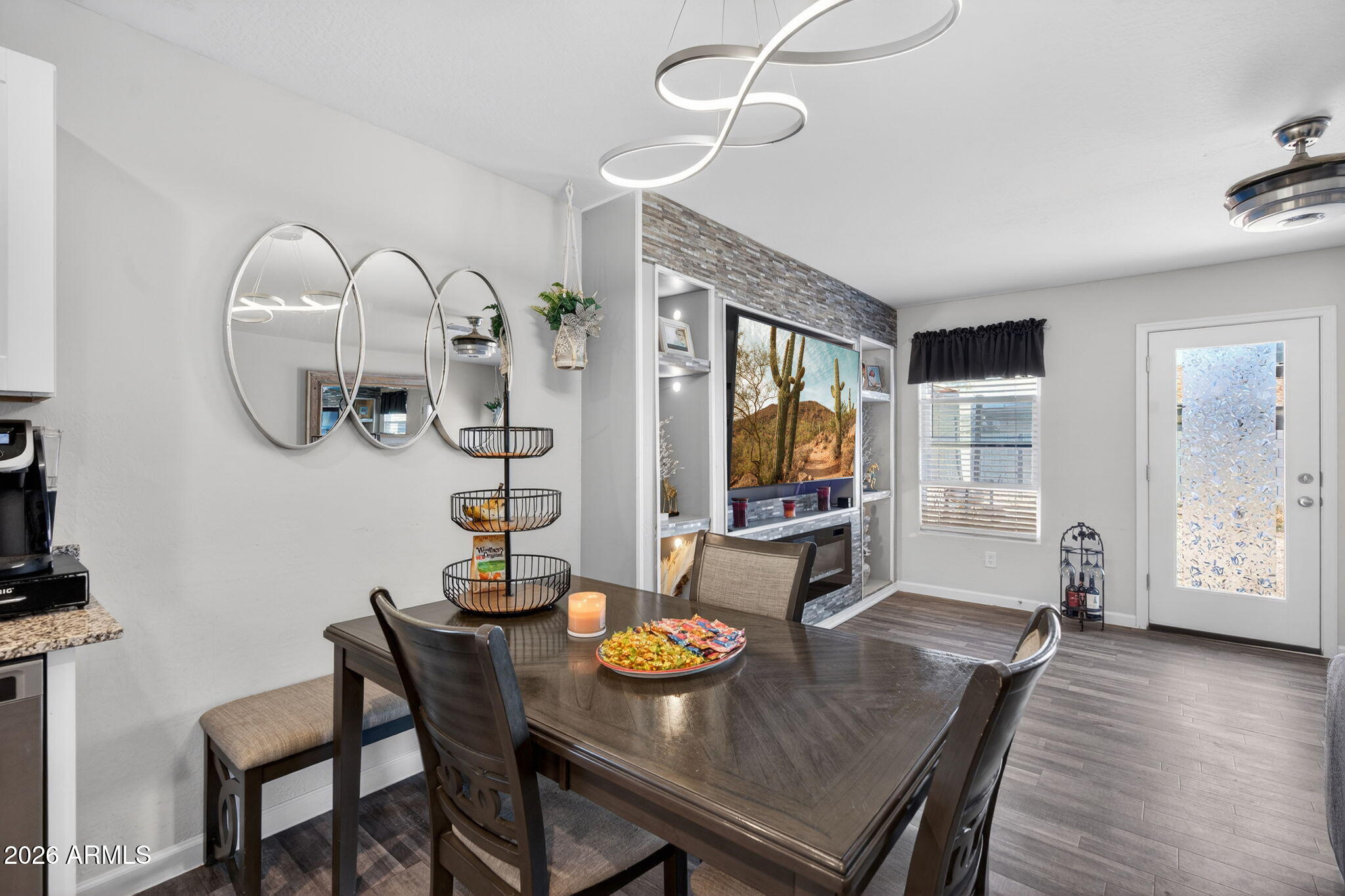 14423 South Capistrano Road Arizona City, AZ 85123 - Photo 10 of 36 a view of a dining room with furniture wooden floor and chandelier