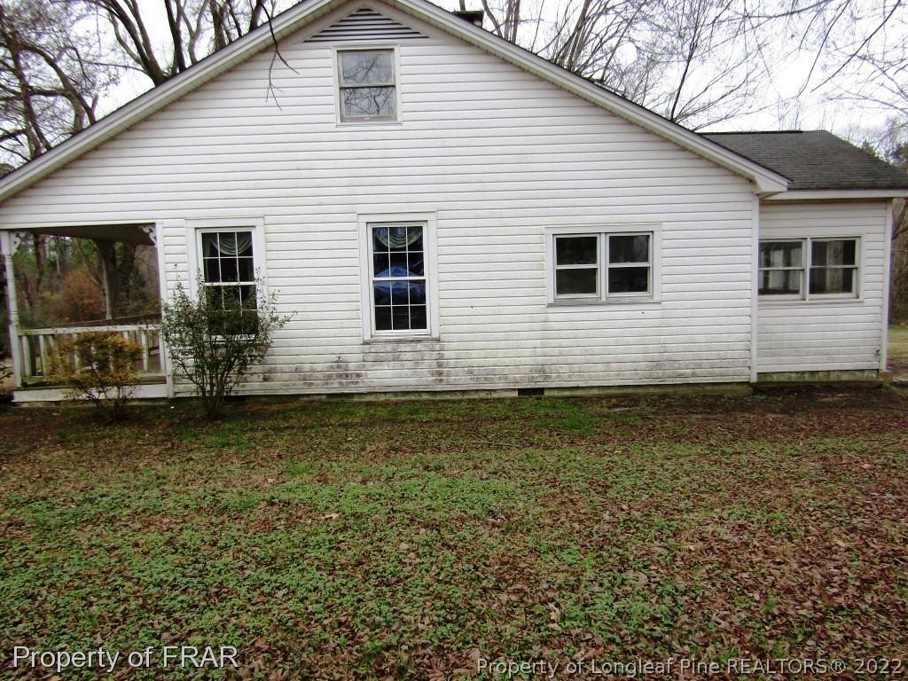 216 Post Office Road Moncure, NC 27559 - Photo 3 of 16 a view of a house with a yard