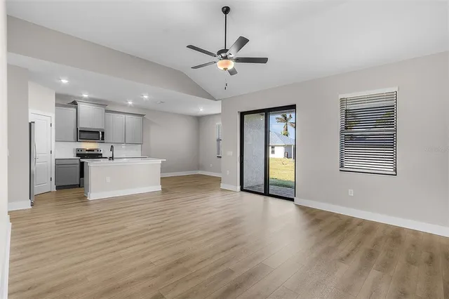 a view of a kitchen with a sink and a window