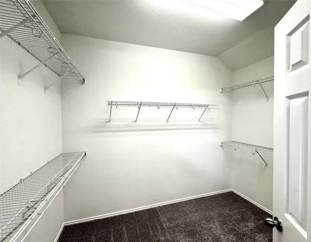 a view of a room with racks on the wall