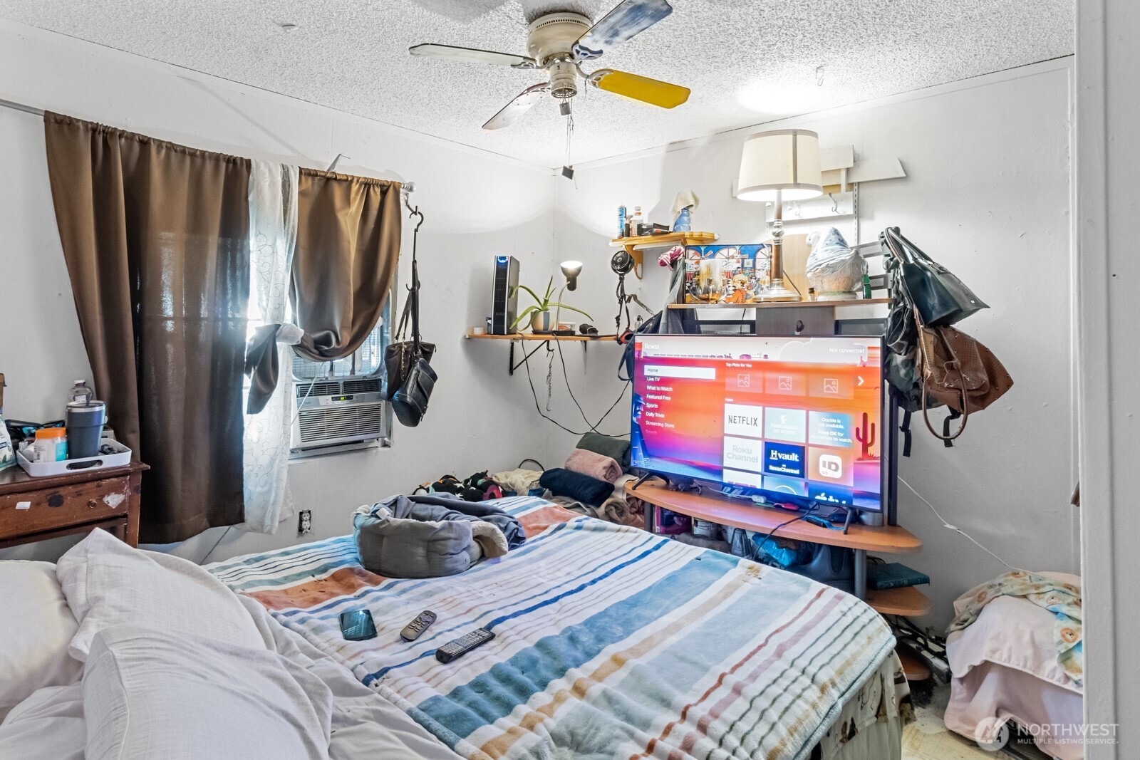 510 Duterrow Road Southeast, Unit 34 Olympia, WA 98513 - Photo 11 of 20 a bedroom with a bed a window and dresser
