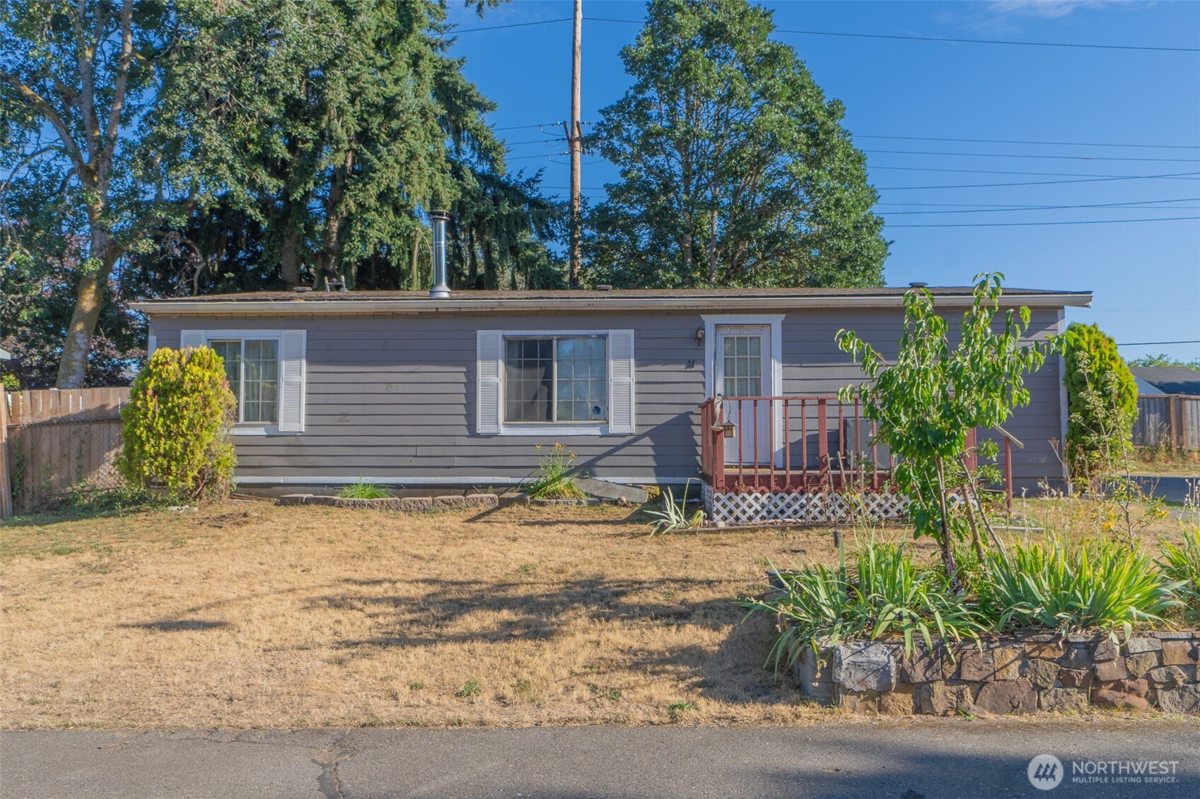 510 Duterrow Road Southeast, Unit 34 Olympia, WA 98513 - Photo 17 of 20 a backyard of a house with potted plants and seating space