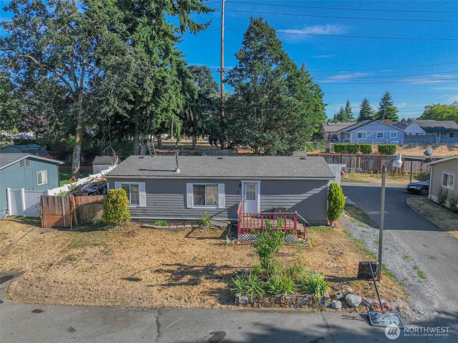 510 Duterrow Road Southeast, Unit 34 Olympia, WA 98513 - Photo 19 of 20 front view of a house with a chairs