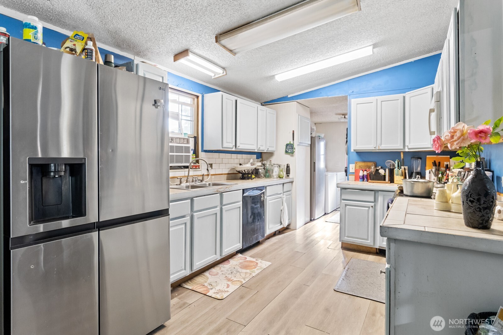 510 Duterrow Road Southeast, Unit 34 Olympia, WA 98513 - Photo 5 of 20 a kitchen with refrigerator cabinets and white appliances