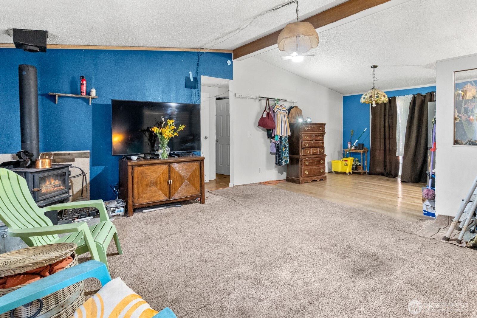 510 Duterrow Road Southeast, Unit 34 Olympia, WA 98513 - Photo 9 of 20 a view of a living room with furniture and a flat screen tv