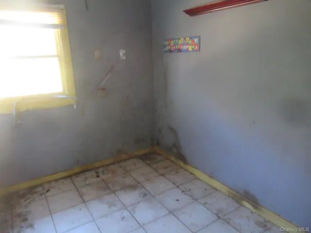 a bathroom with a toilet a sink and shower