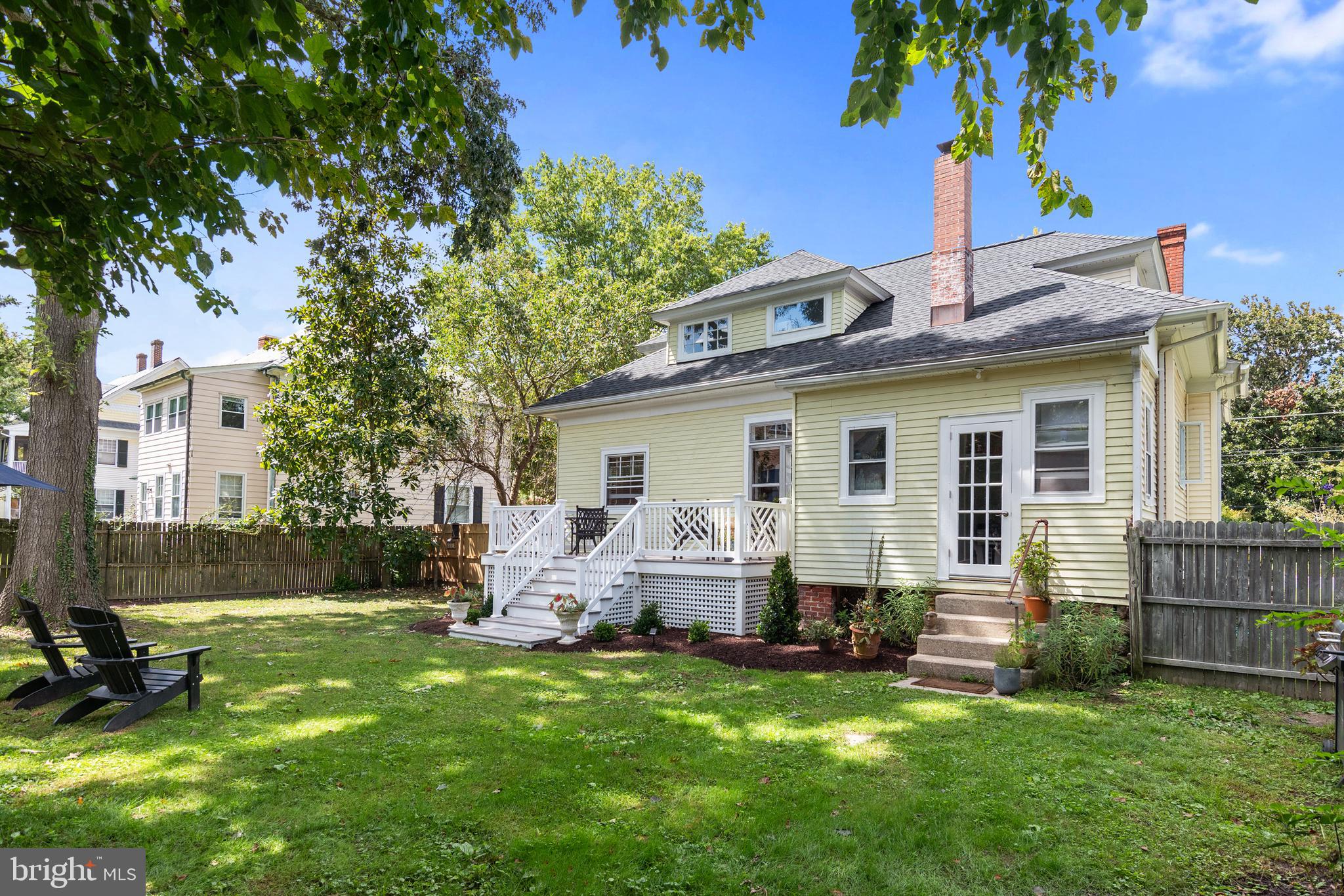 306 Oakley Street Cambridge, MD 21613 - Photo 11 of 35 a view of a house with a backyard and a patio