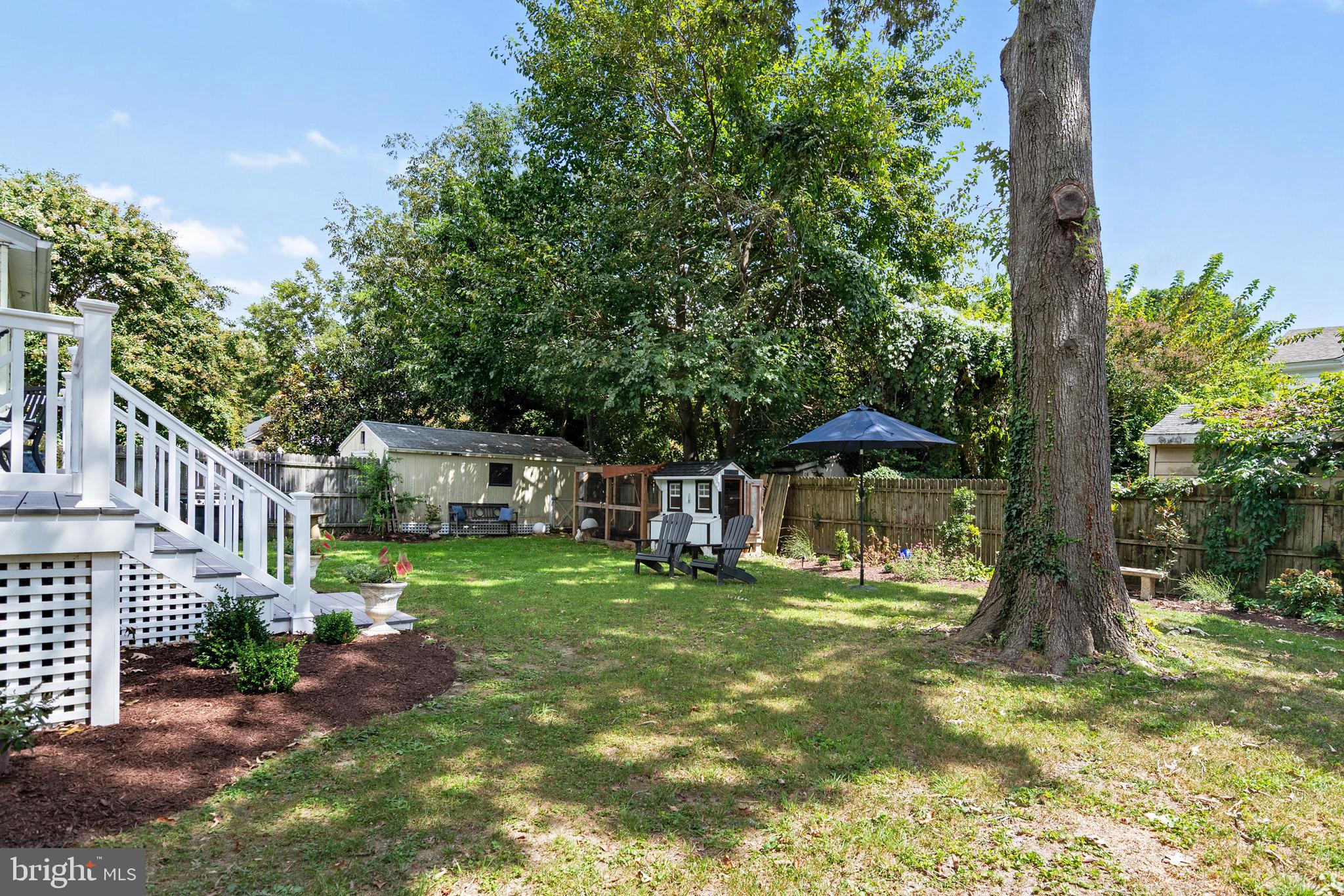 306 Oakley Street Cambridge, MD 21613 - Photo 12 of 35 a small house in middle of the green field