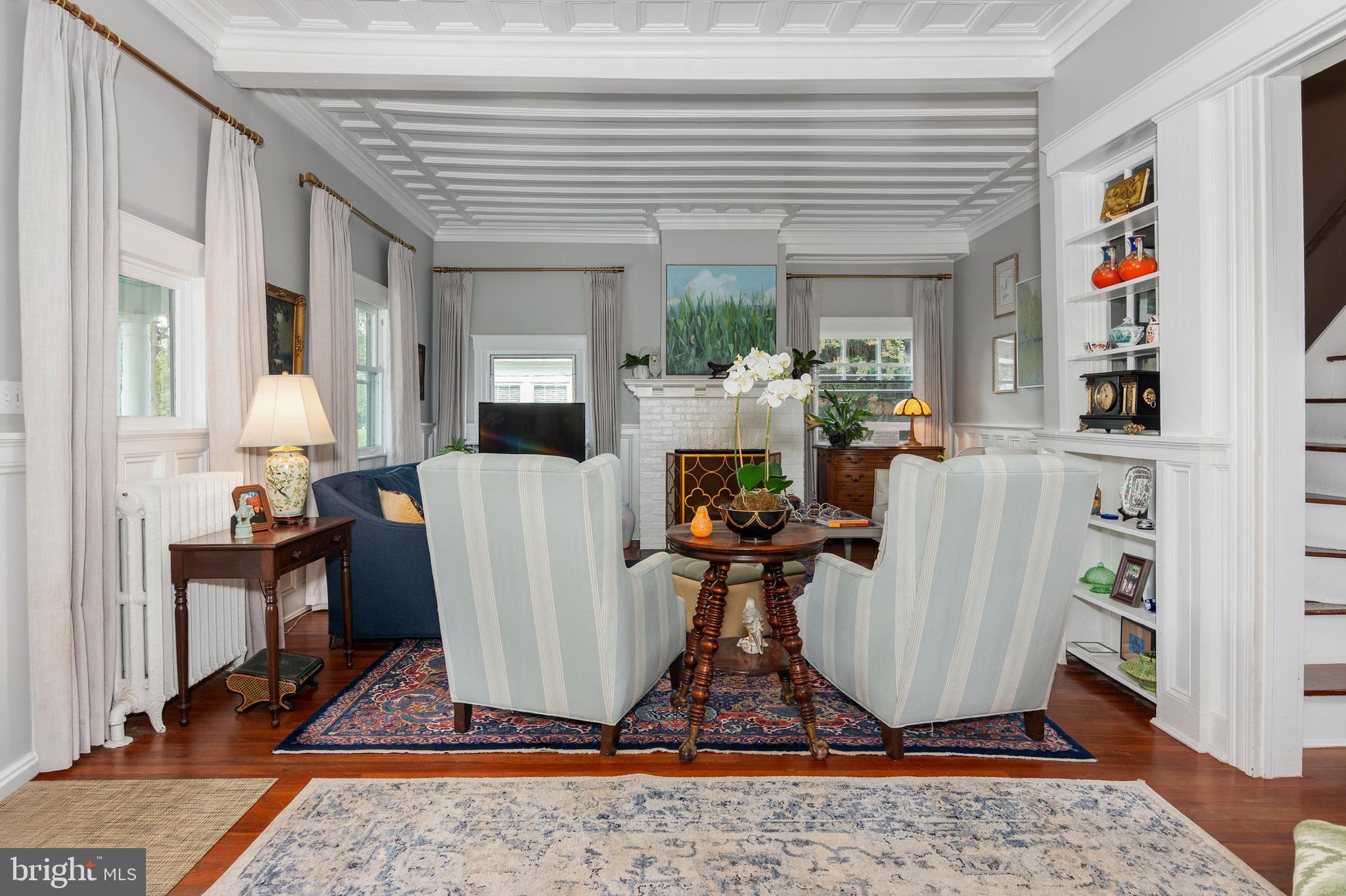 306 Oakley Street Cambridge, MD 21613 - Photo 15 of 35 a living room with furniture a rug and a table