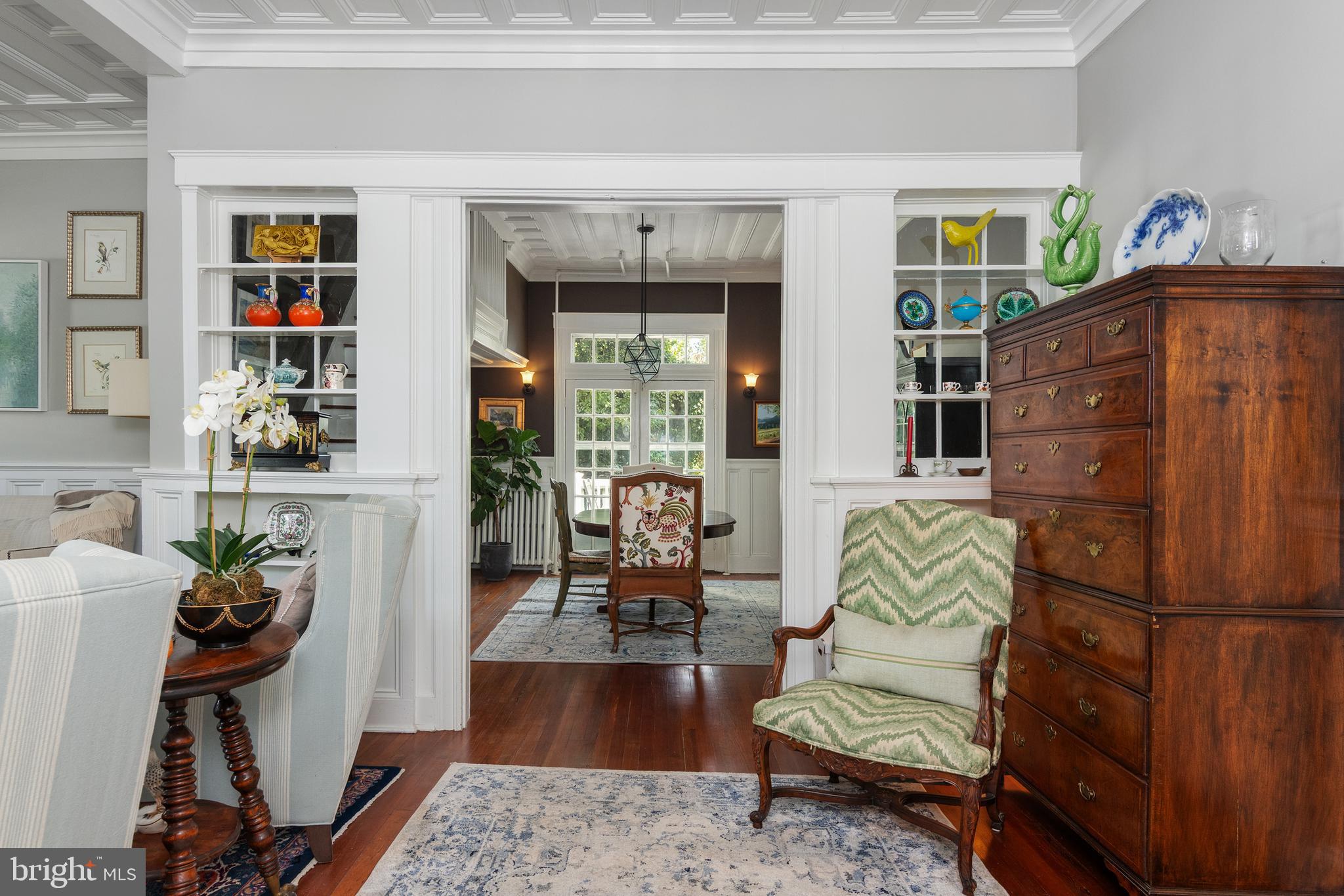 306 Oakley Street Cambridge, MD 21613 - Photo 19 of 35 a living room with furniture a rug and a window