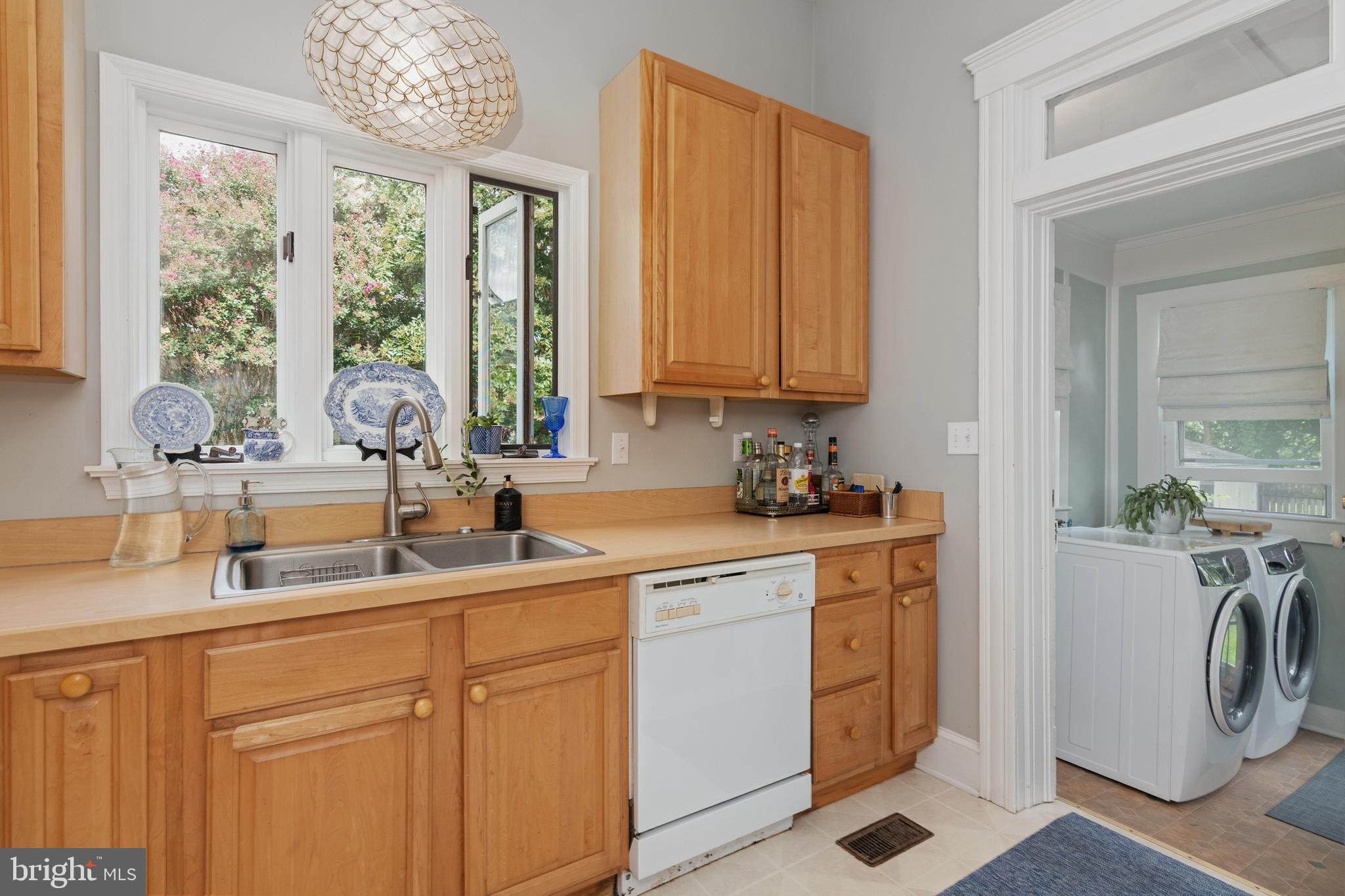 306 Oakley Street Cambridge, MD 21613 - Photo 27 of 35 a kitchen with a sink cabinets and window