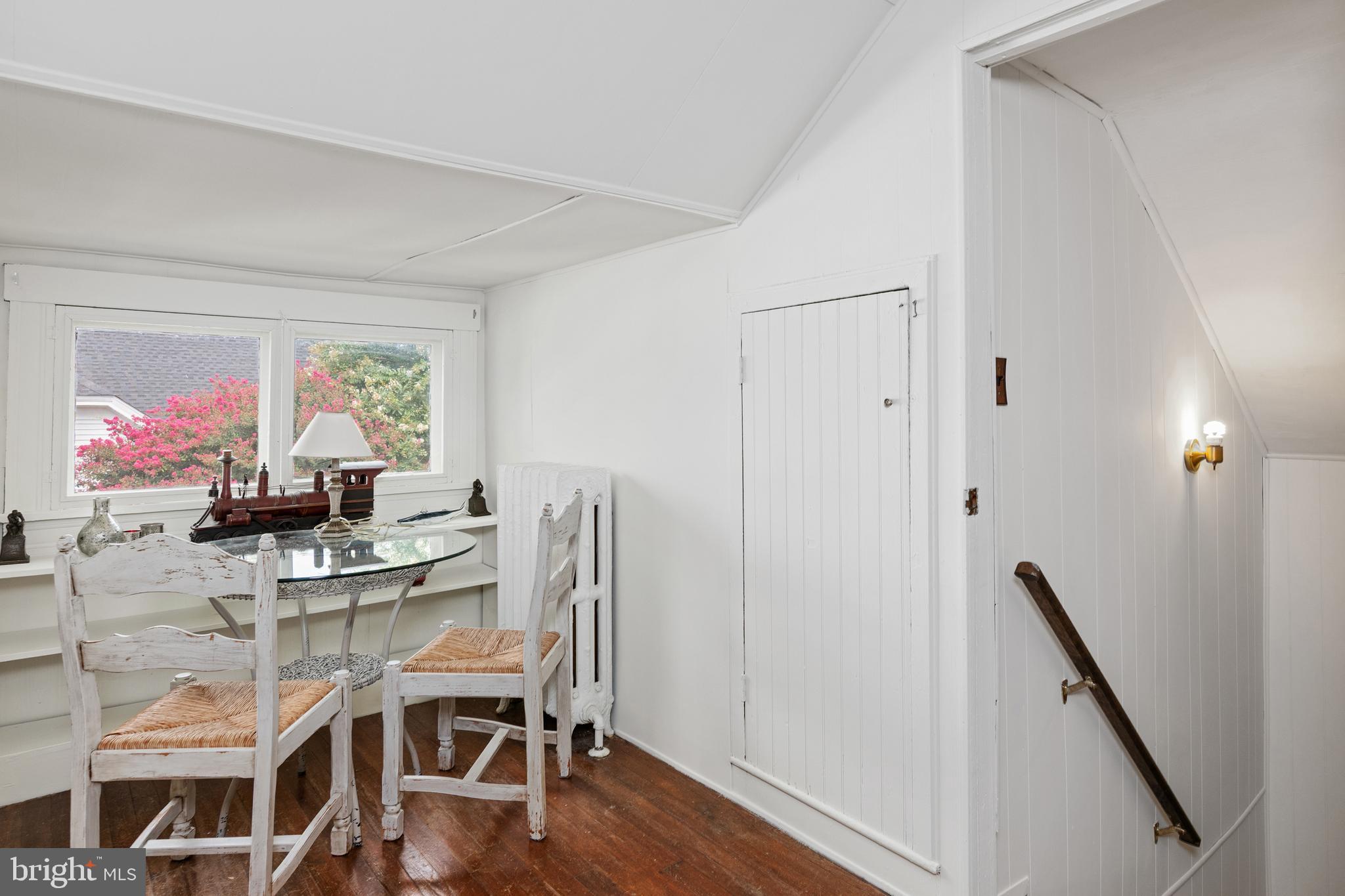 306 Oakley Street Cambridge, MD 21613 - Photo 31 of 35 a view of a workspace with furniture and wooden floor