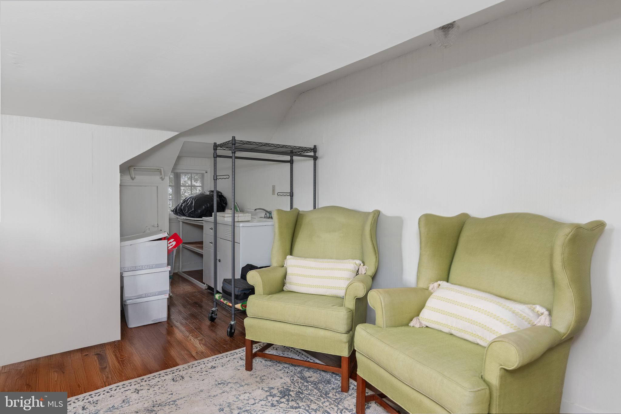 306 Oakley Street Cambridge, MD 21613 - Photo 32 of 35 a living room with furniture and a wooden floor