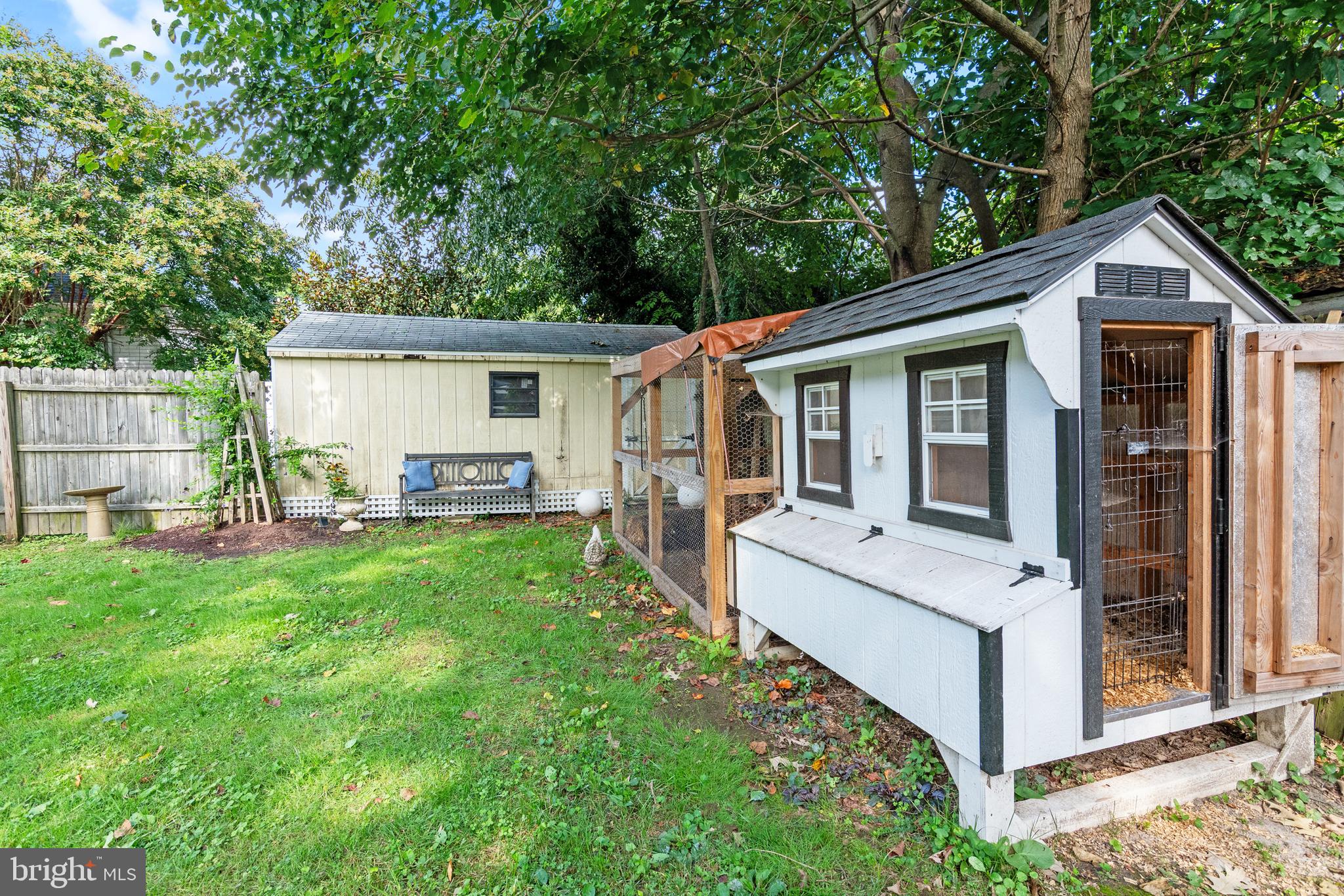 306 Oakley Street Cambridge, MD 21613 - Photo 5 of 35 a view of a house with a yard and porch