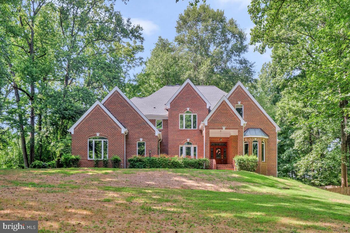 502 Seneca Knoll Court Great Falls, VA 22066 - Photo 1 of 56 a front view of a house with yard