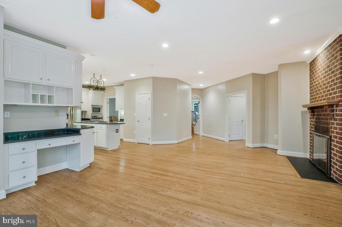 502 Seneca Knoll Court Great Falls, VA 22066 - Photo 22 of 56 a large kitchen with cabinets and stainless steel appliances