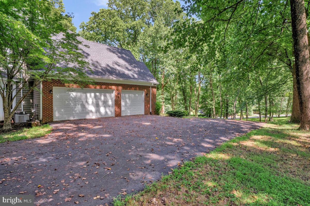 502 Seneca Knoll Court Great Falls, VA 22066 - Photo 3 of 56 a view of a house with yard and a tree