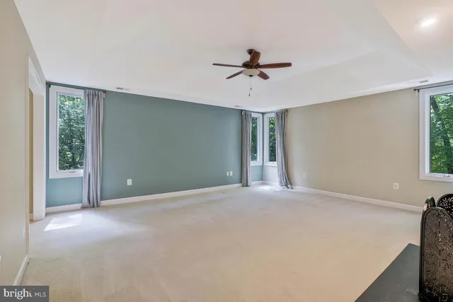 a view of an empty room and a bathroom