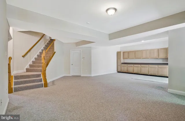 a furnished livingroom with a ceiling fan