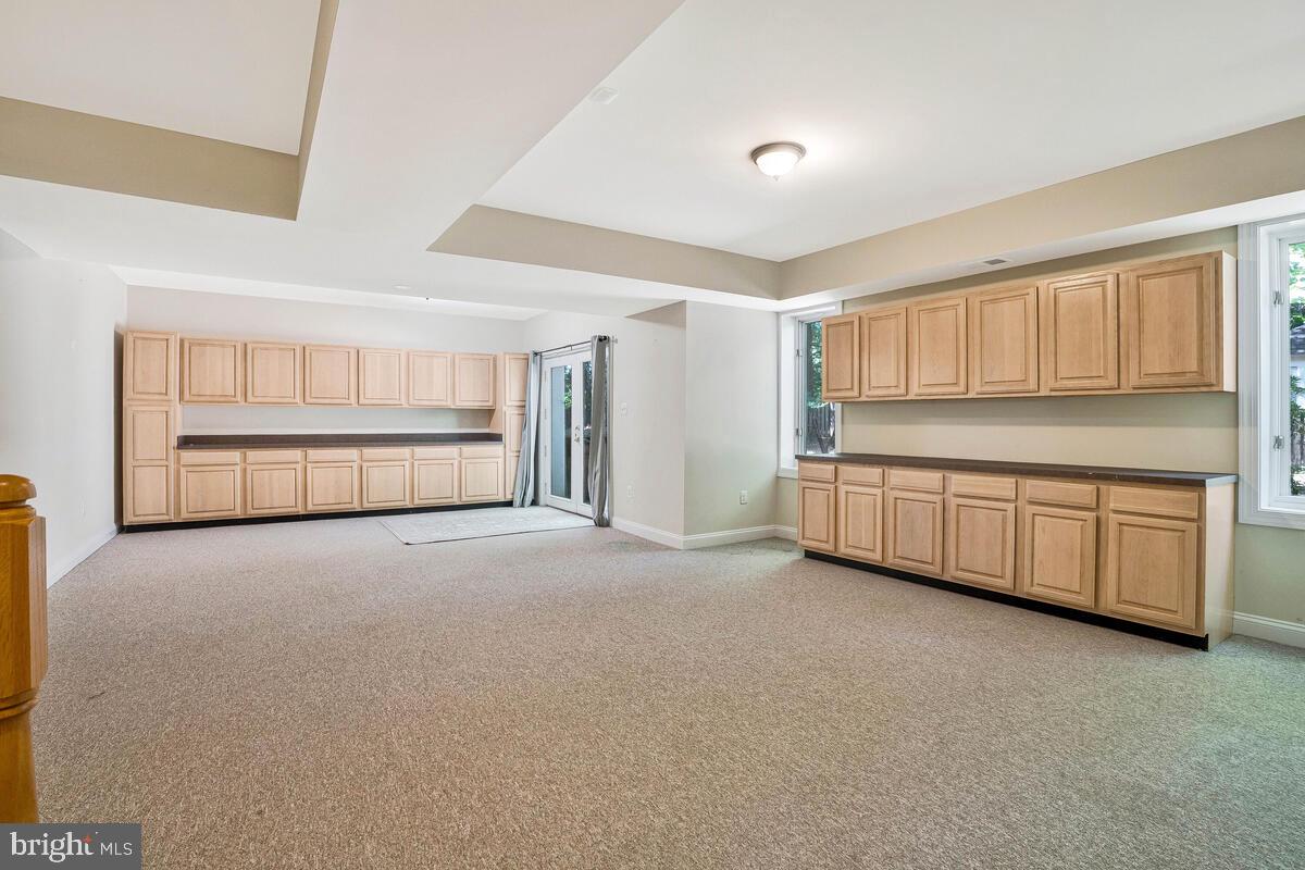 502 Seneca Knoll Court Great Falls, VA 22066 - Photo 43 of 56 a view of an empty room with a kitchen