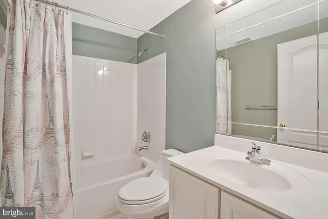 a view of a yard with large trees