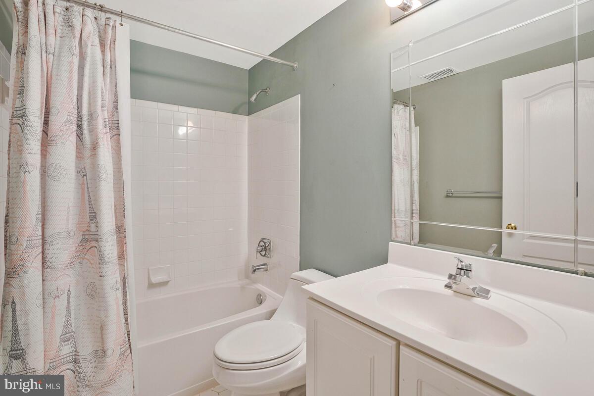 502 Seneca Knoll Court Great Falls, VA 22066 - Photo 44 of 56 a bathroom with a sink toilet and shower