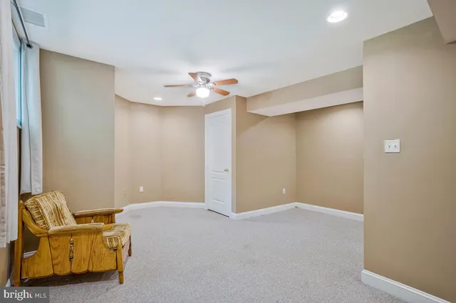 a house with green field in front of it