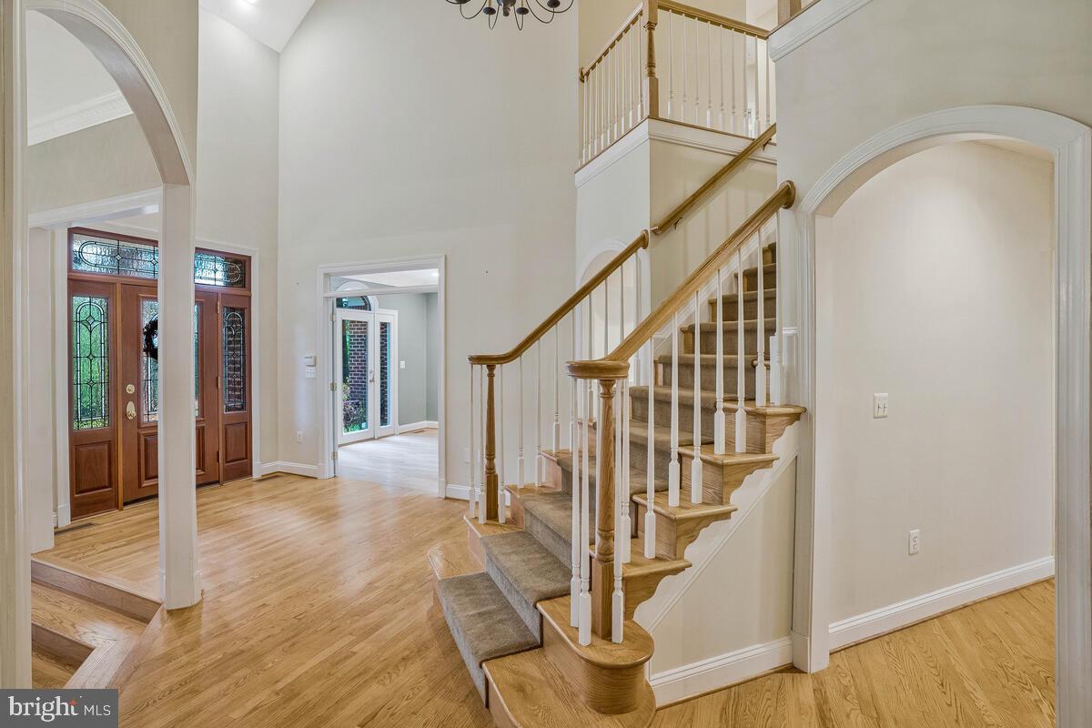 502 Seneca Knoll Court Great Falls, VA 22066 - Photo 6 of 56 a view of entryway and hall with wooden floor