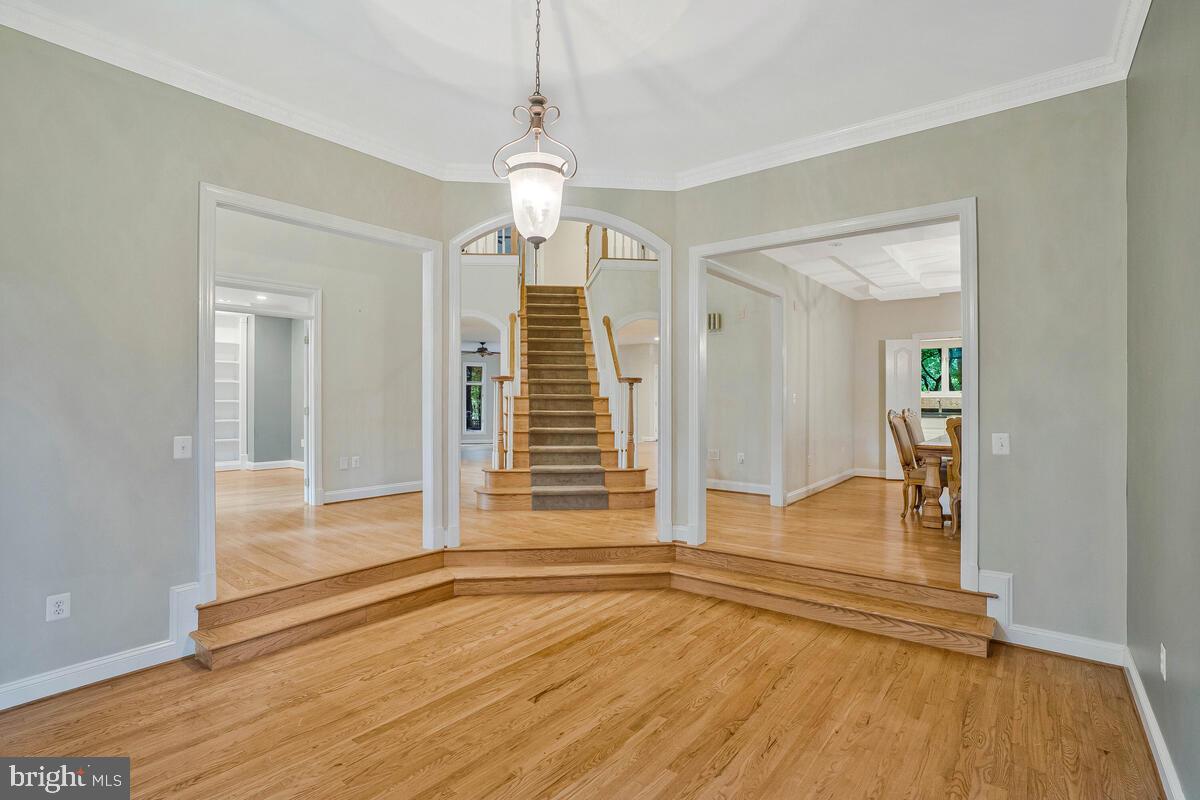 502 Seneca Knoll Court Great Falls, VA 22066 - Photo 10 of 56 a view of a livingroom with wooden floor and stairs