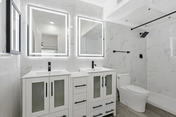 an aerial view of a house with swimming pool and patio