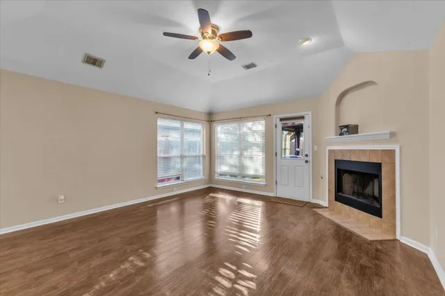 a bathroom with a sink vanity granite tub and shower