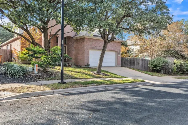 a view of a house with palm trees