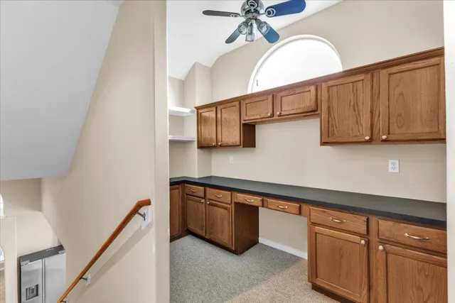 a front view of a house with yard and green space