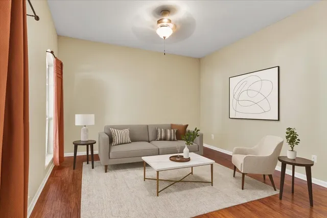 a living room with furniture and a window