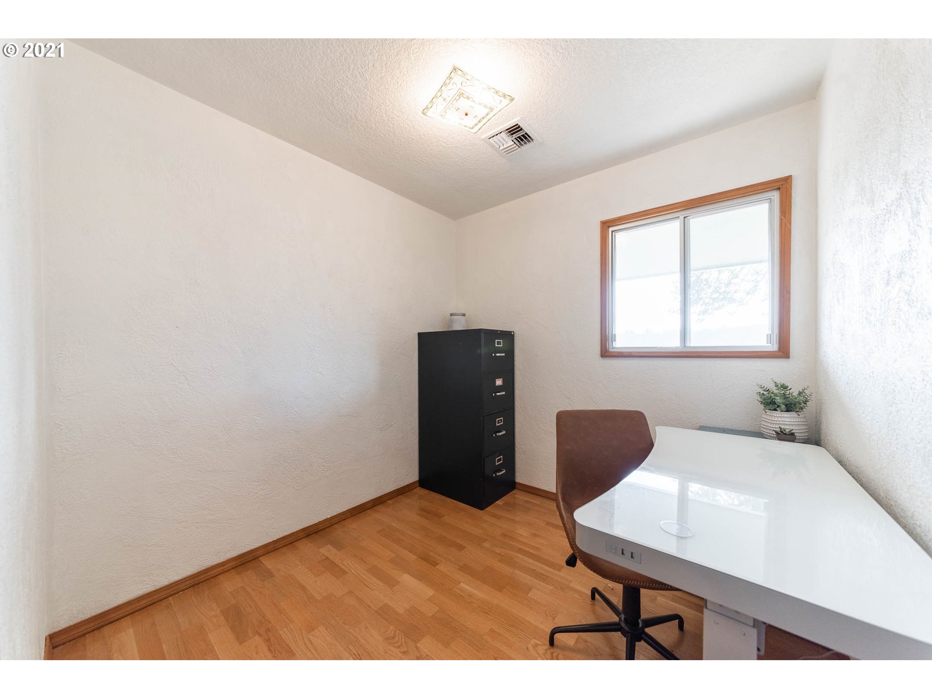 37931 M J Chase Road Springfield, OR 97478 - Photo 18 of 32 a bedroom with a bed and a chair